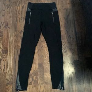EUC athleta black leggings with faux leather trim/zipper